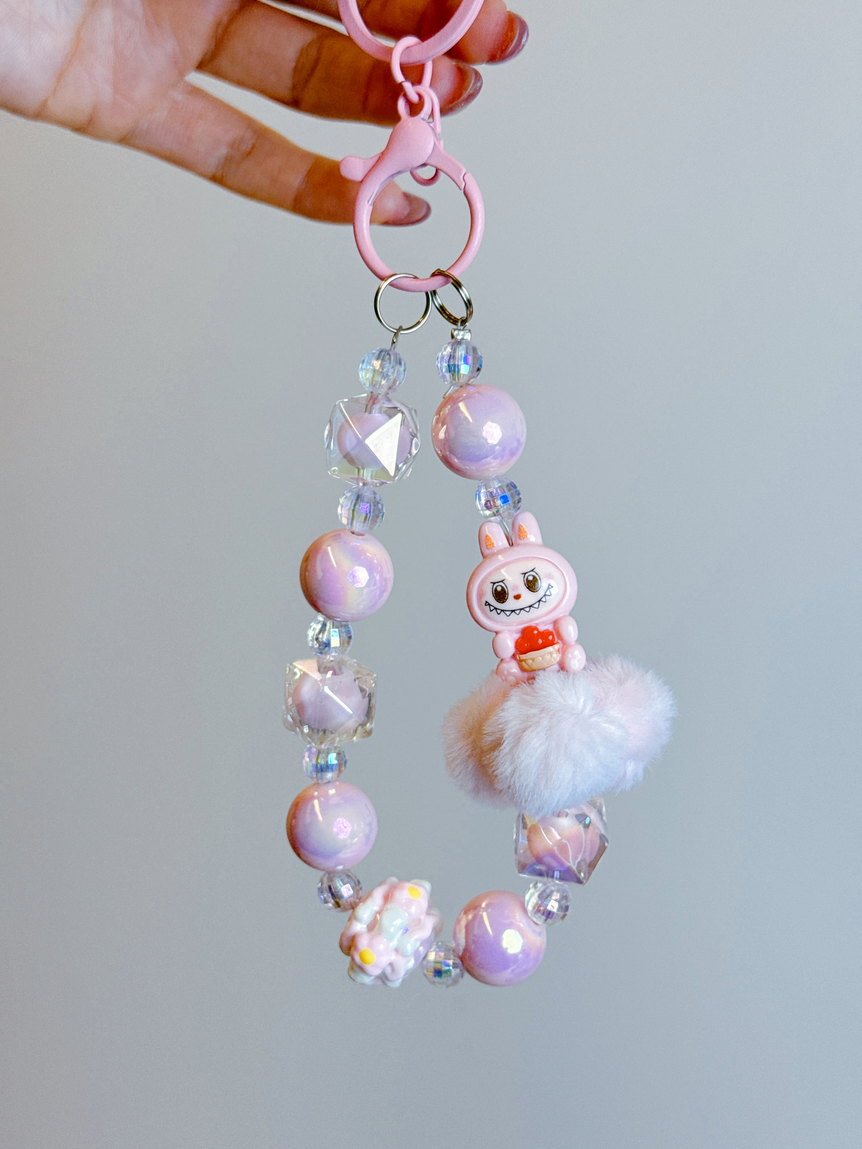 Labubu Phone Chain – Beaded Wrist Strap with Fluffy Pom-Pom & Resin Mini-Doll Charm