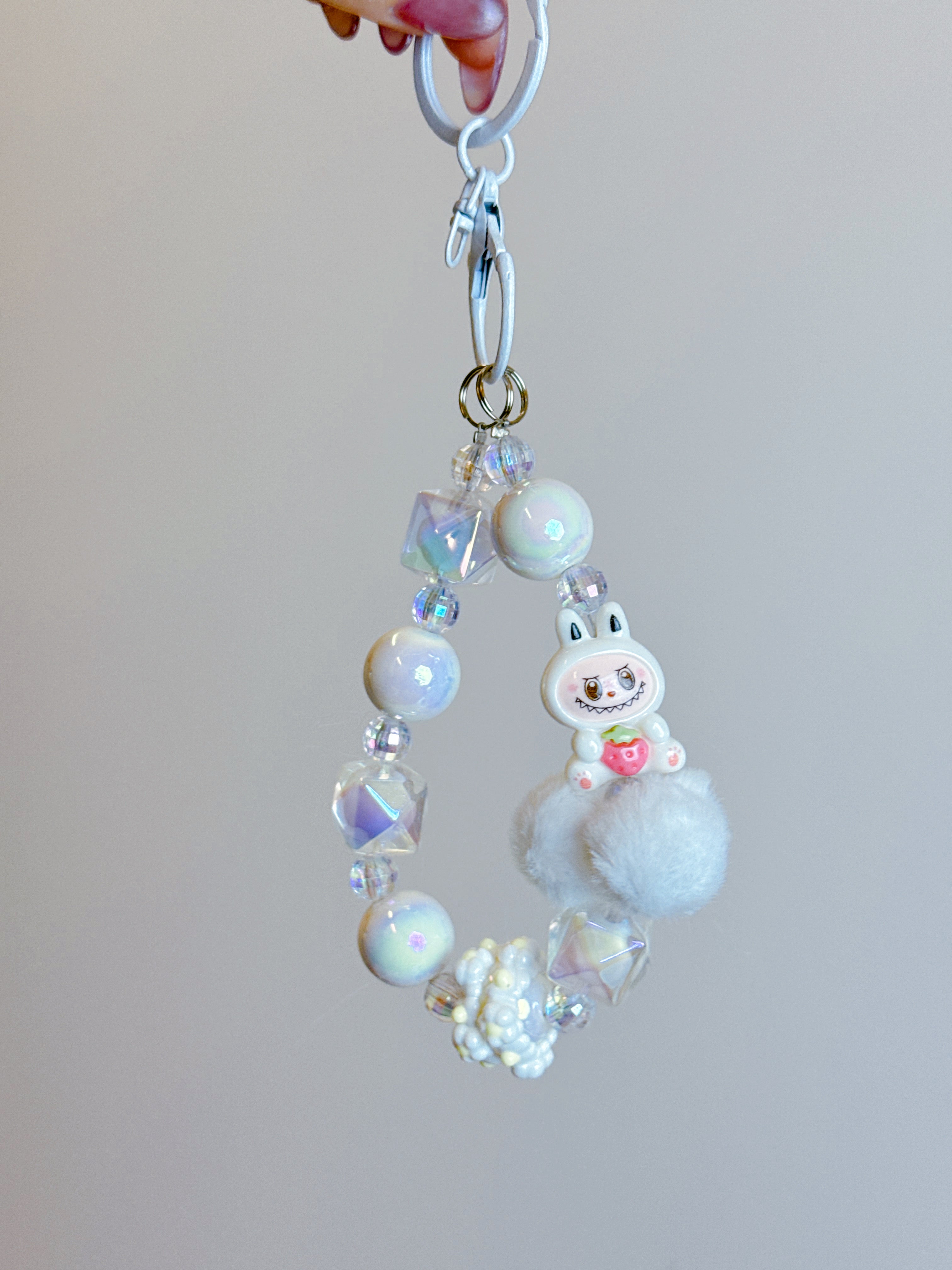 Labubu Phone Chain – Beaded Wrist Strap with Fluffy Pom-Pom & Resin Mini-Doll Charm
