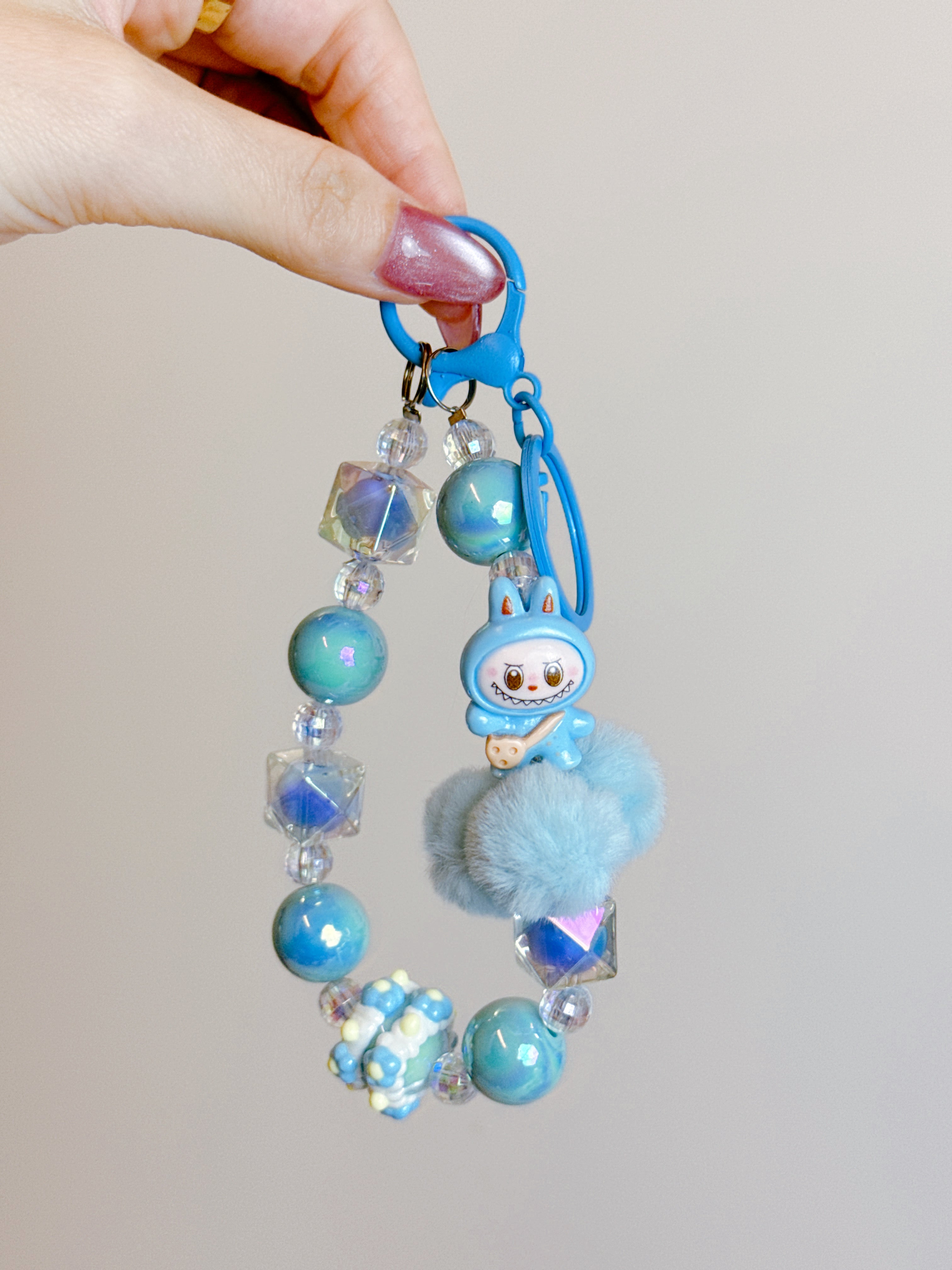 Labubu Phone Chain – Beaded Wrist Strap with Fluffy Pom-Pom & Resin Mini-Doll Charm