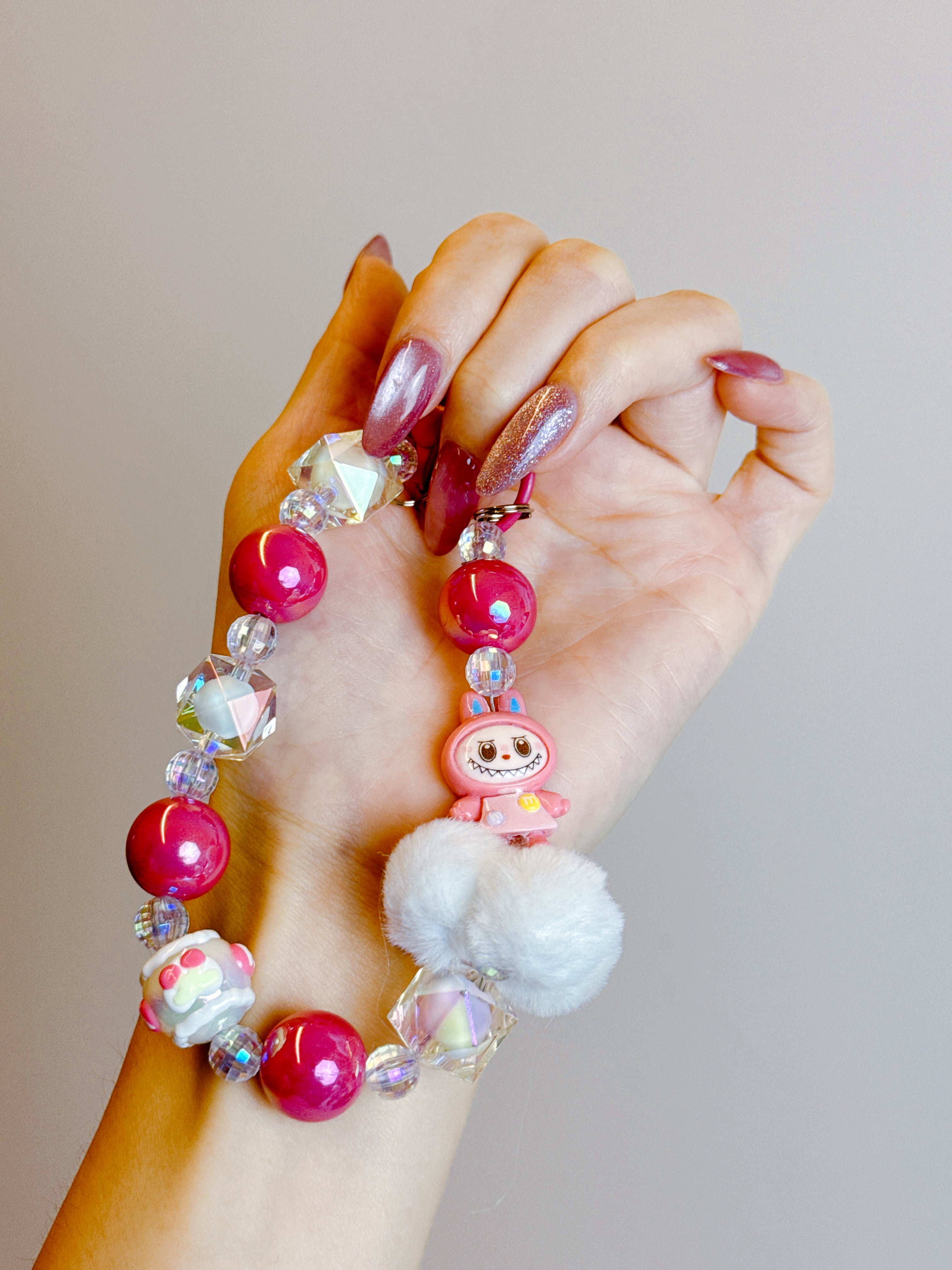 Labubu Phone Chain – Beaded Wrist Strap with Fluffy Pom-Pom & Resin Mini-Doll Charm