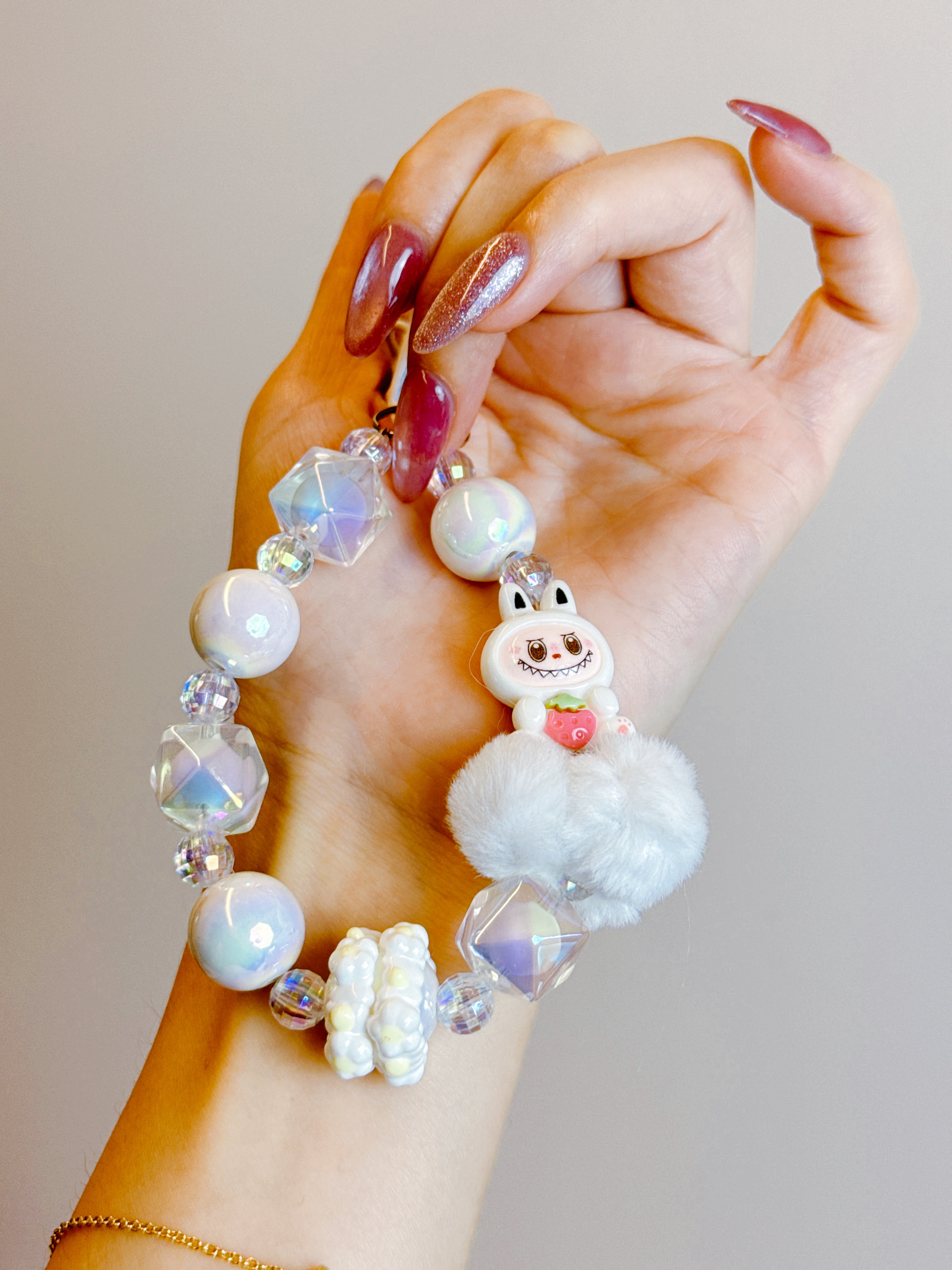 Labubu Phone Chain – Beaded Wrist Strap with Fluffy Pom-Pom & Resin Mini-Doll Charm