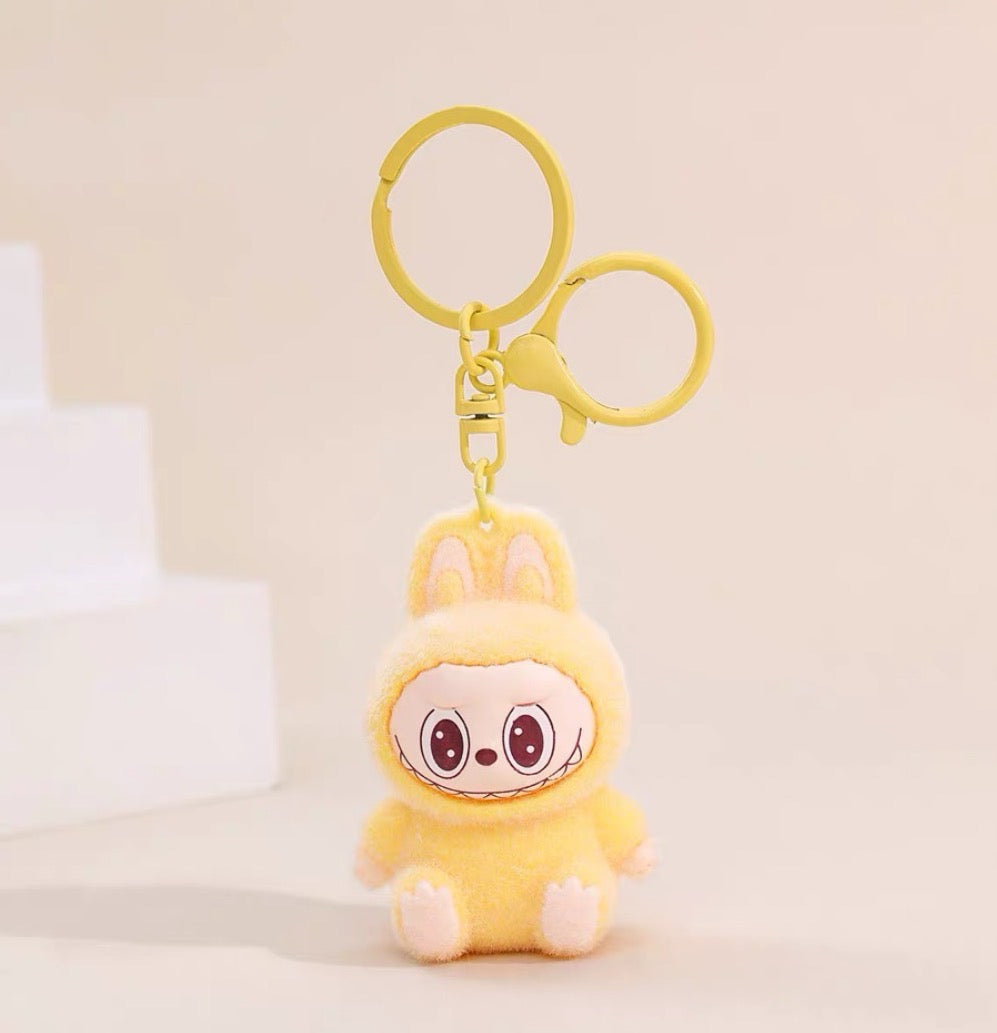 Labubu Sherling Plush Keychain – Pastel Mini Doll on Swirl Cookie Seat